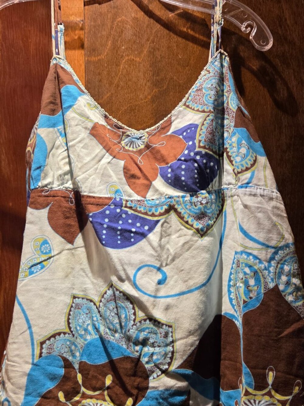 Camisole top featuring a prominent bohemian floral and paisley pattern